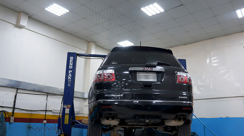 GMC Acadia on a workshop lift