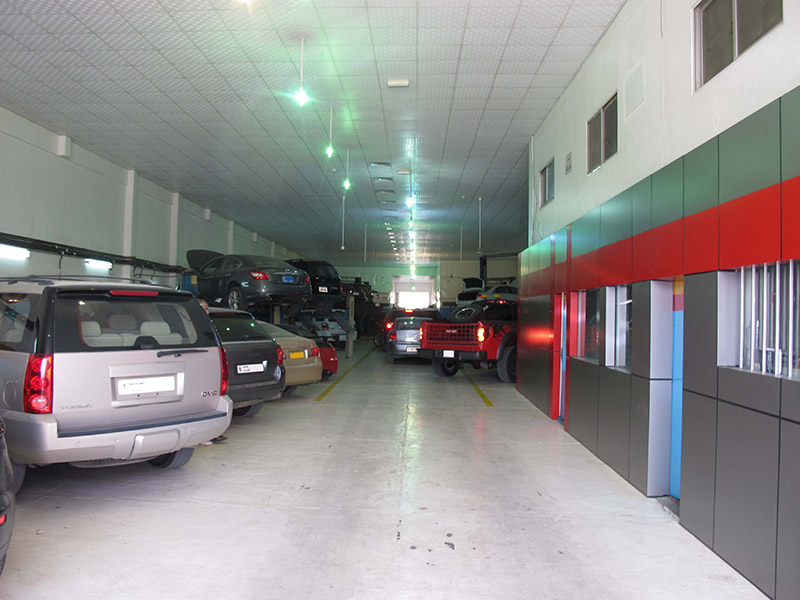 Workshop interior with cars on lifts